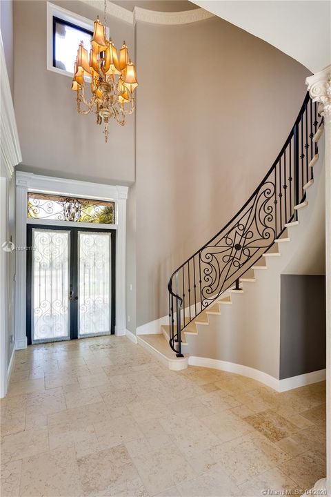 Entry and elegant curved staircase
