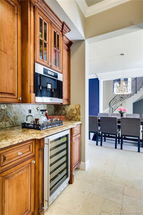 Efficient butlers pantry with built-in Miele espresso machine