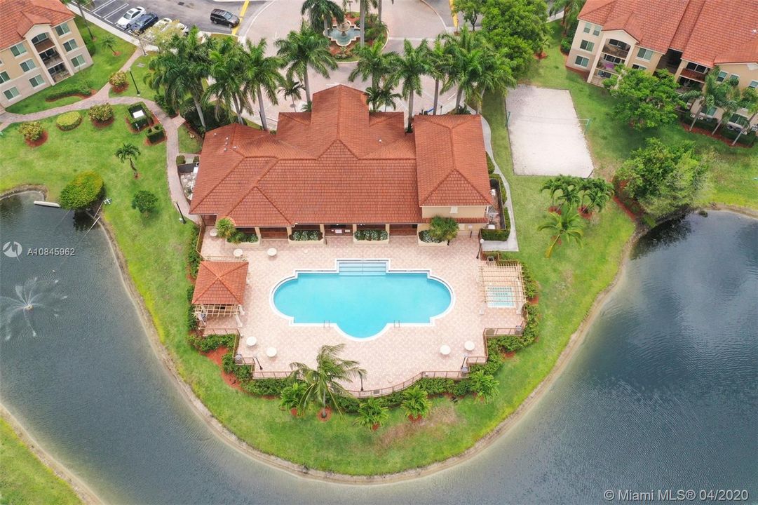 Arial of club house and amenities. Pool & Hot Tub, Volleyball court, BBQ area and gym inside.