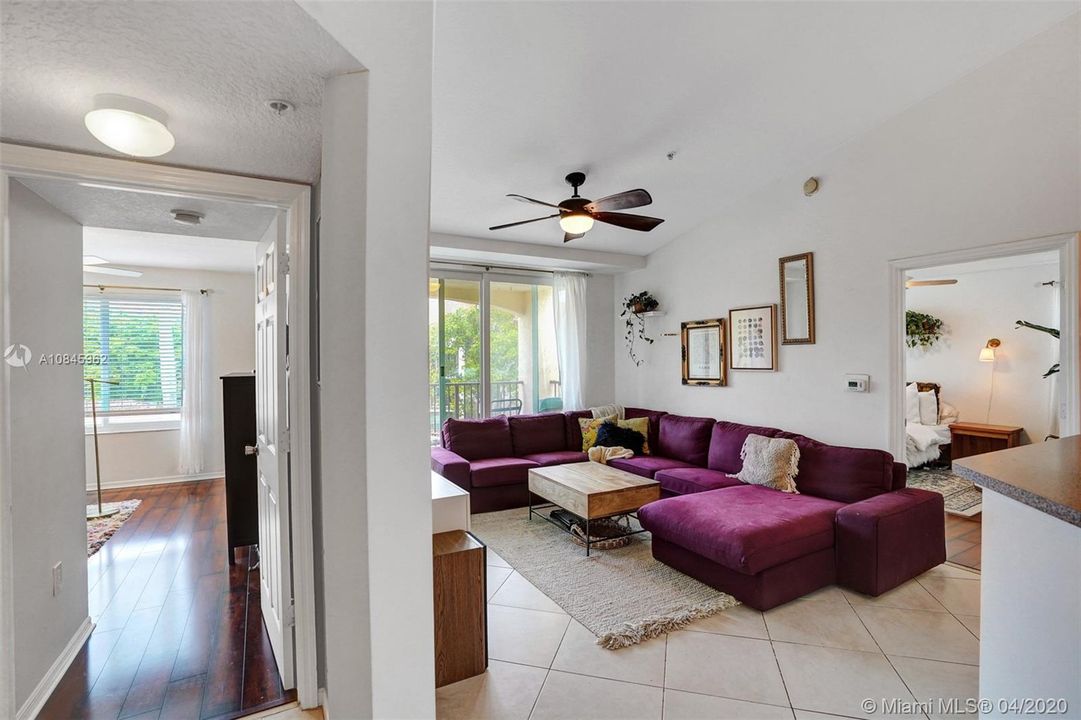 Left wood floors is Guest Bedroom and Wood floor room across the way is Master Bedroom separated by Family room.