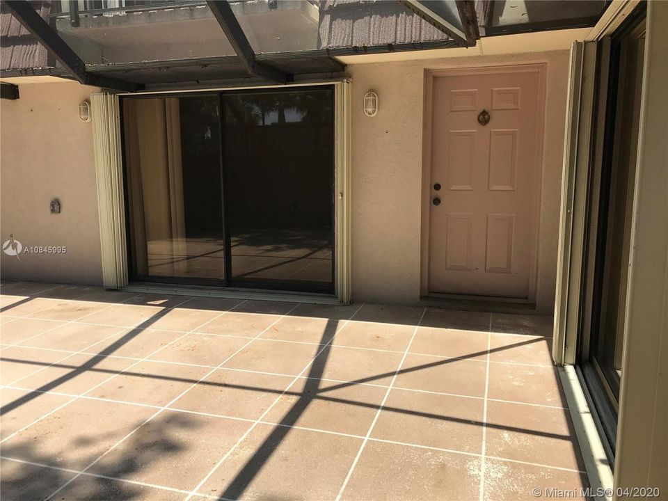 Screened in Patio with privacy fence