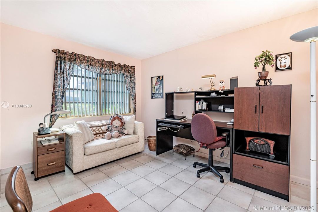 Second bedroom with tile flooring