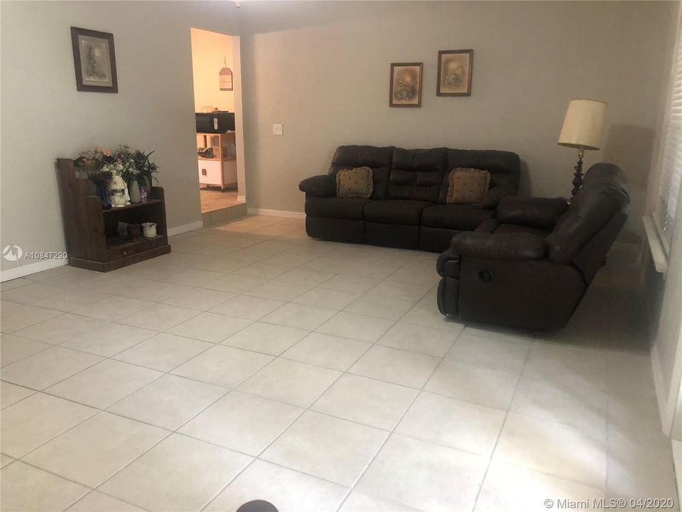 Spacious living as entering the back porch area
