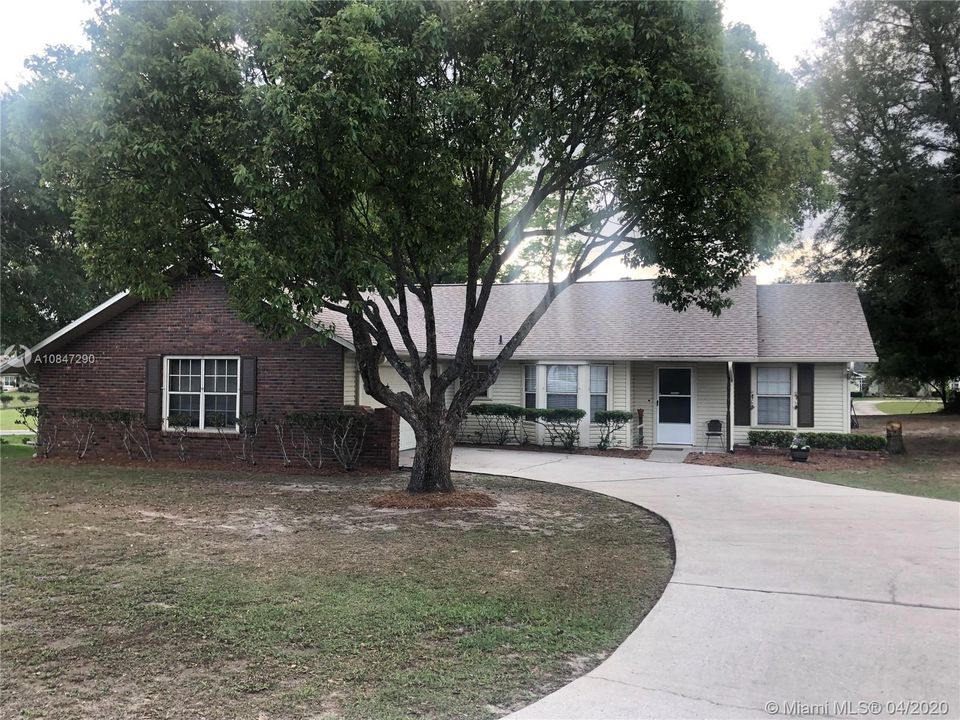 Front House, with long curved driveway and large front yard