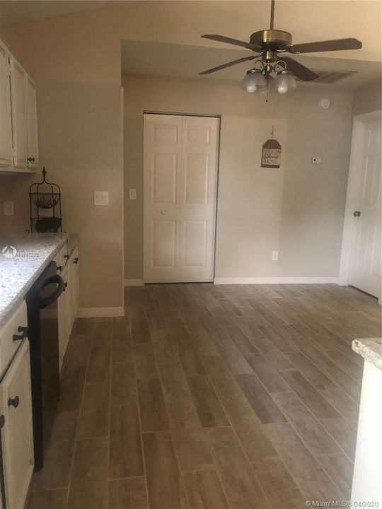 Open kitchen, ceiling fan, pantry, beautiful tiled floor.