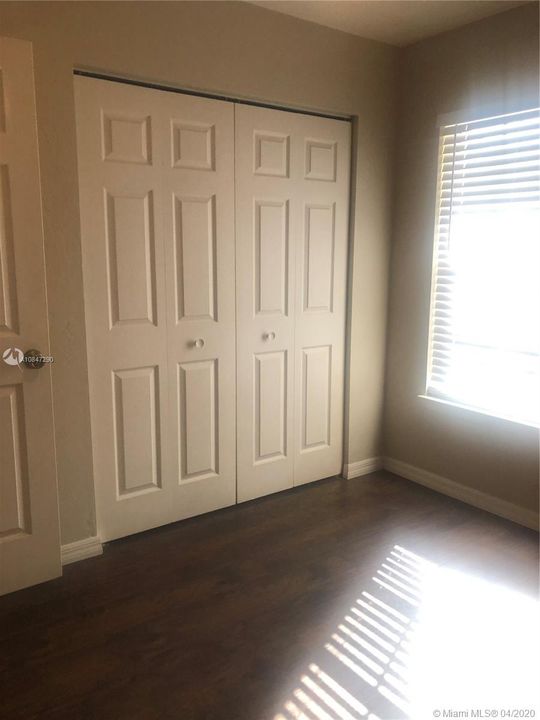 Bedroom 3 wood blinds, & wood closet doors