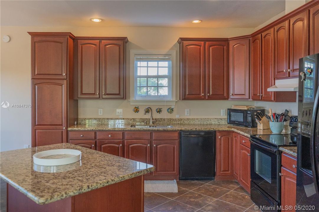 Granite Counters, Wood cabinets and Recess lighting
