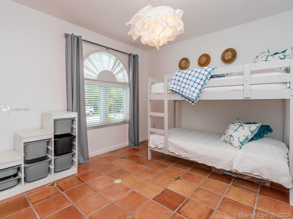 Lots of natural light coming in from beautiful arched window