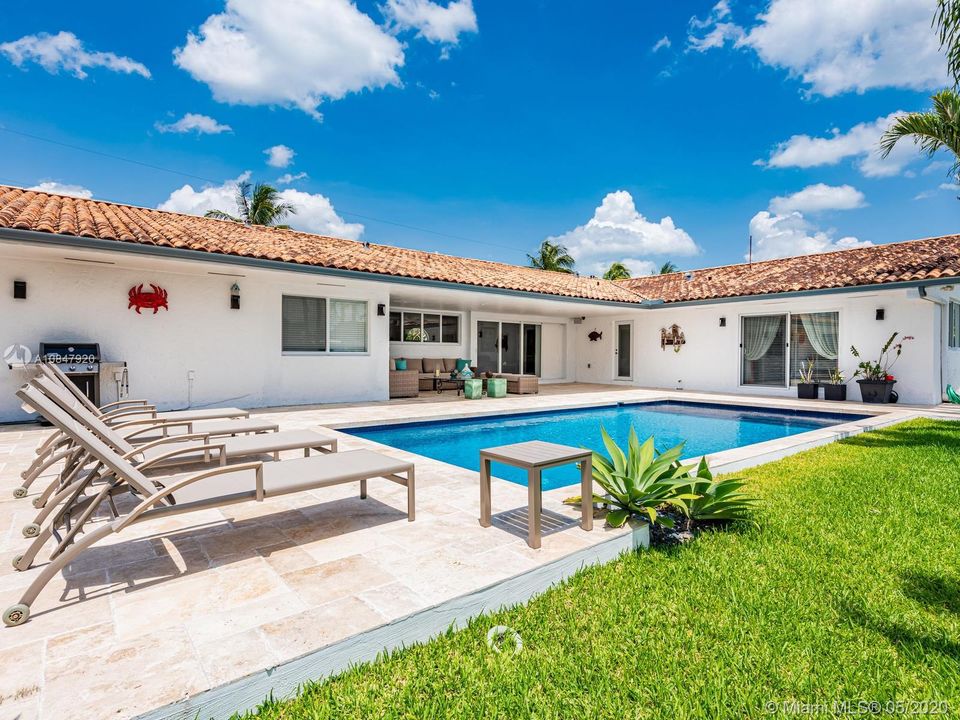 Green space as well as large pool patio