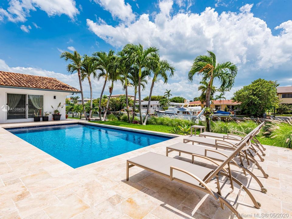 Large pool and patio complete this outdoor living area