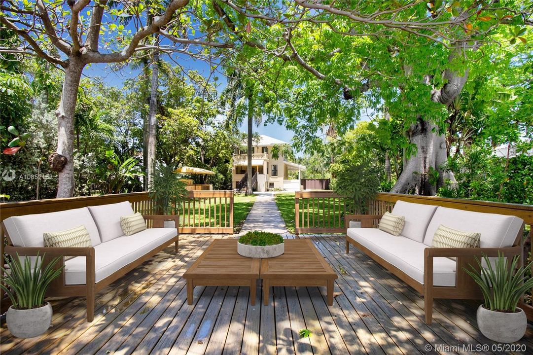 Deck "Living Room" located alongside the river. The perfect spot to lounge and enjoy the water crafts as they go by.