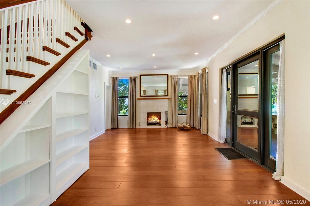 Gas Fireplace, hardwood floors, tall ceilings and numerous windows grace the living areas.