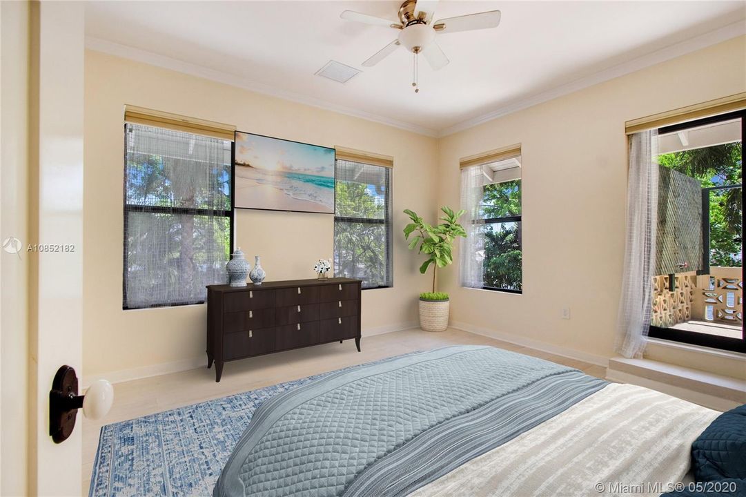 Largest of all bedrooms--access to open balcony at right. Views of expansive backyard and river from here!