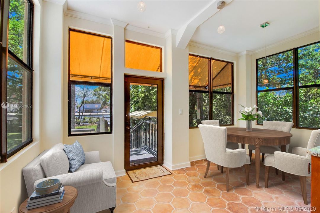 Back room is the perfect setting for a breakfast area or sitting room.