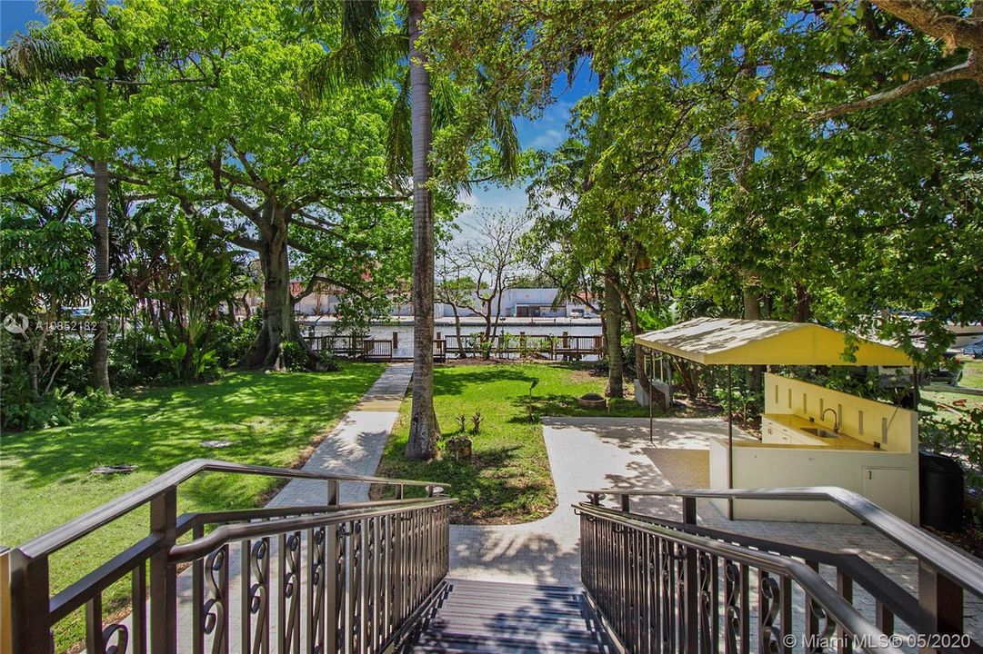 Back Stairs leading from the elevated living areas to the back gardens and riverfront/dock!