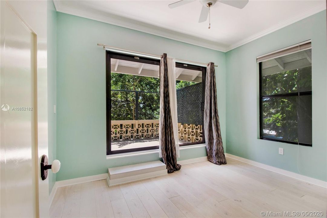 The Green Room enjoys access to the back balcony offering views of backyard and river (south and west)
