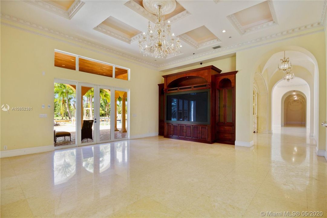 Living room with entrance to the patio and pool