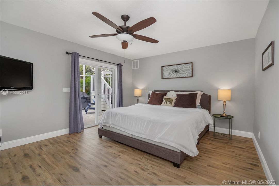 1st Floor Master Bedroom - Sliders to pool area.