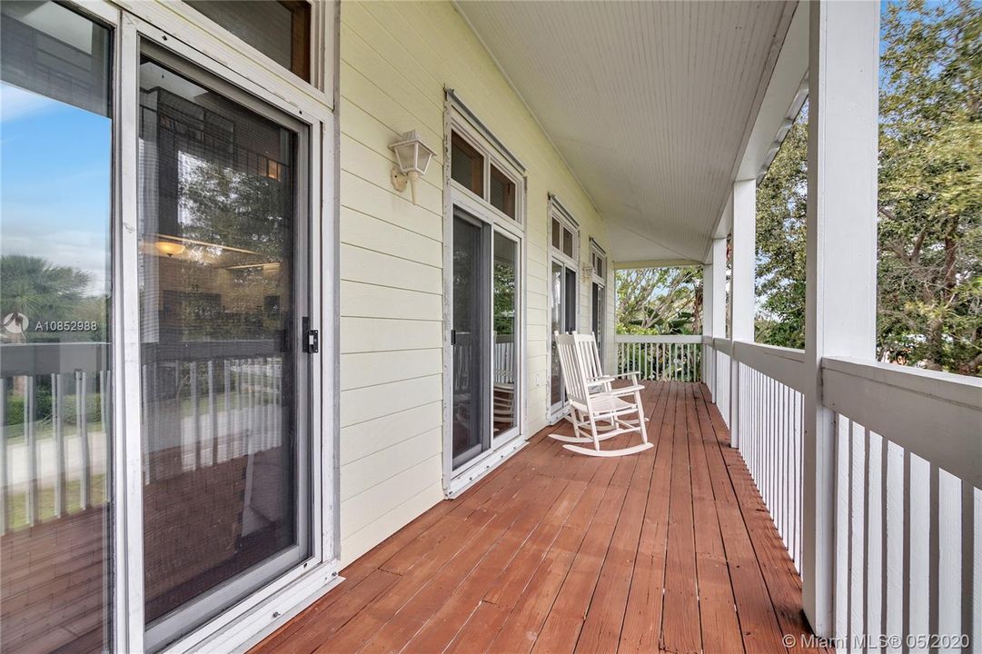 Full Wraparound Porch - Other side of porch is screened in and has two ceiling fans. Views of intracoastal can be seen from this area.