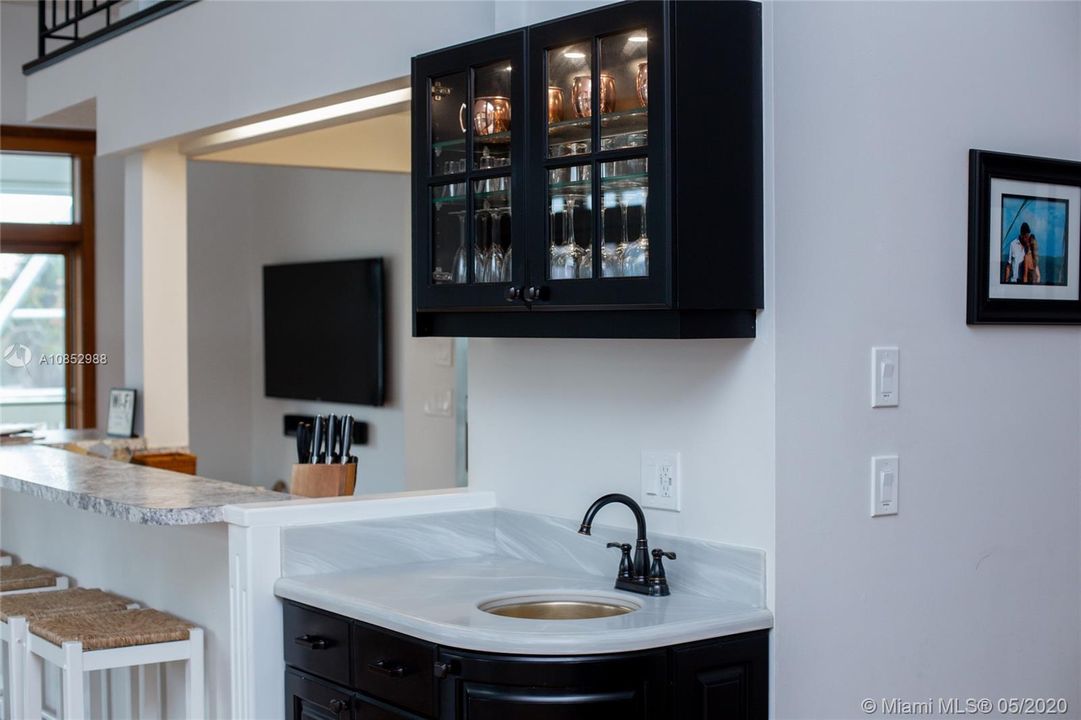 Wet bar near dining room on 2nd floor.