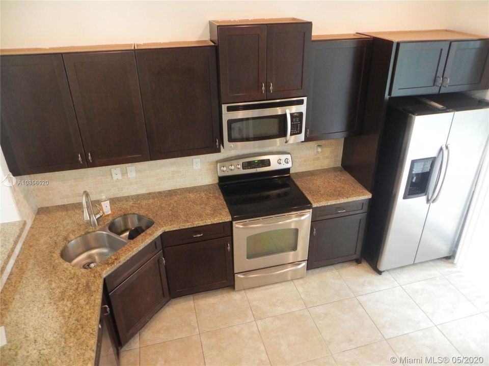 Over look from staircase into Kitchen