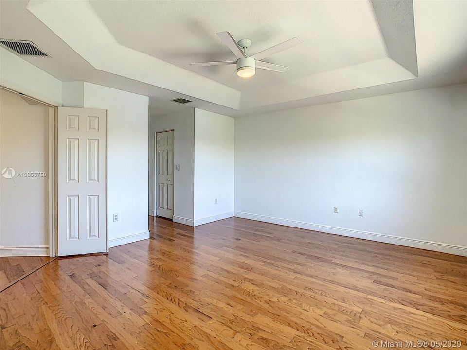 hallway in master bed to his and hers walk in closets