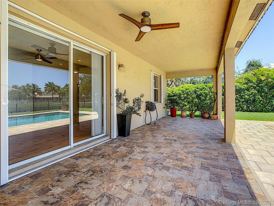 huge covered patio to enjoy the pool and backyard and the views