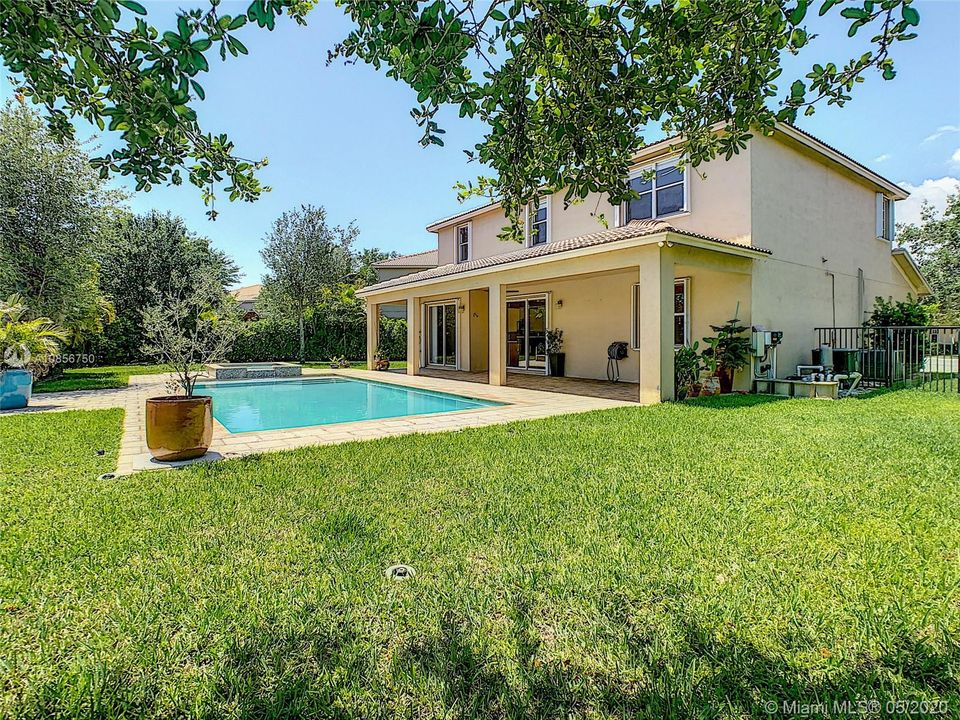 backyard with a lot of space for kids and pet