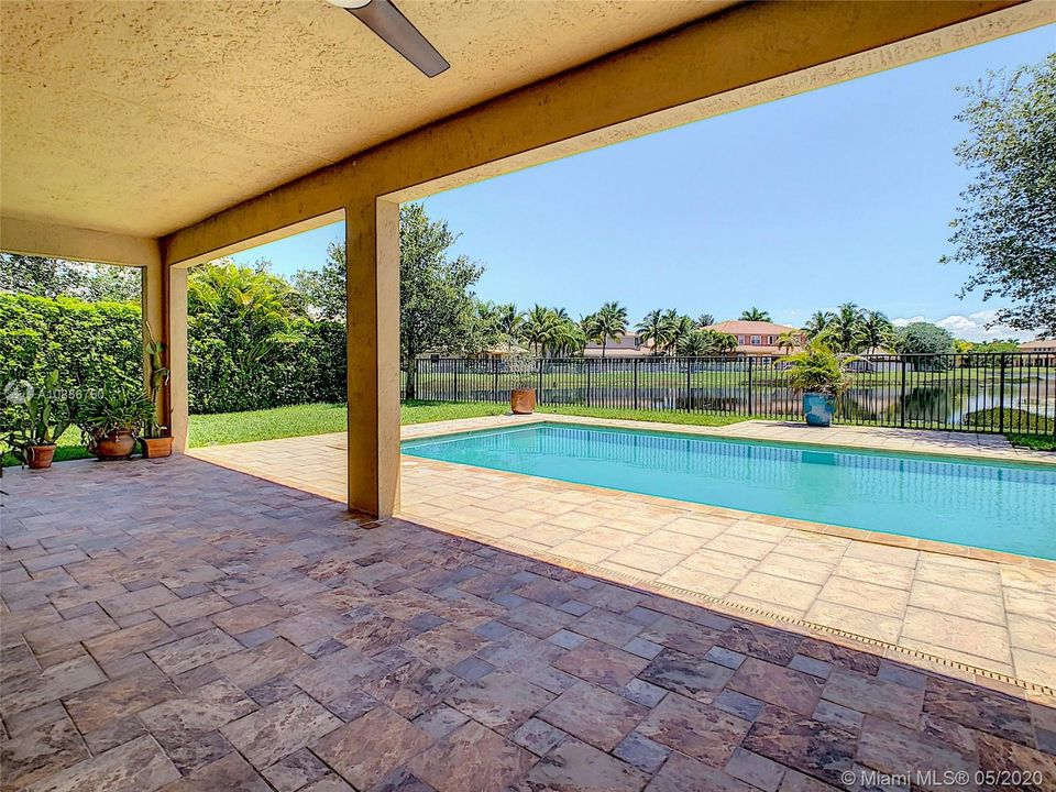 enjoy the pool and lake views, relax in your backyard