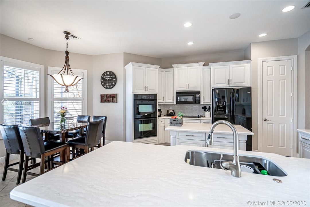 Eat in kitchen with quartz counters & large pantry