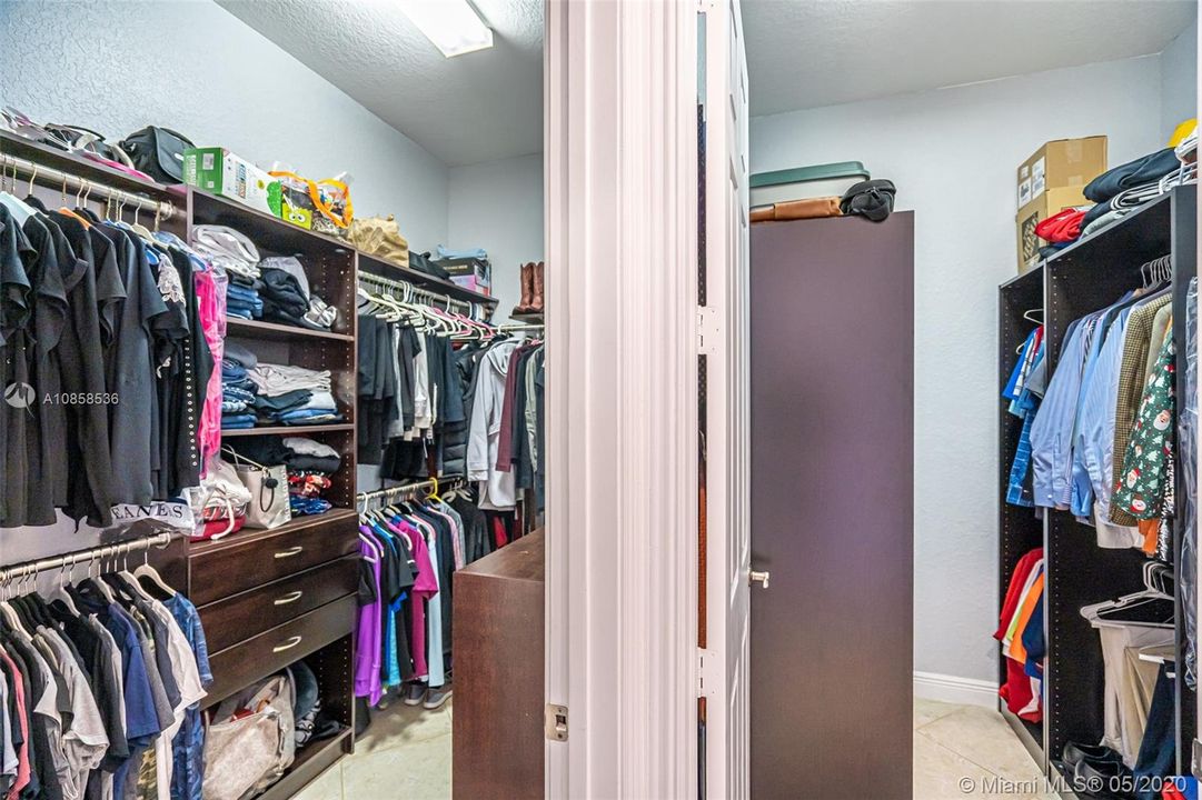 fitted his and her closet in master