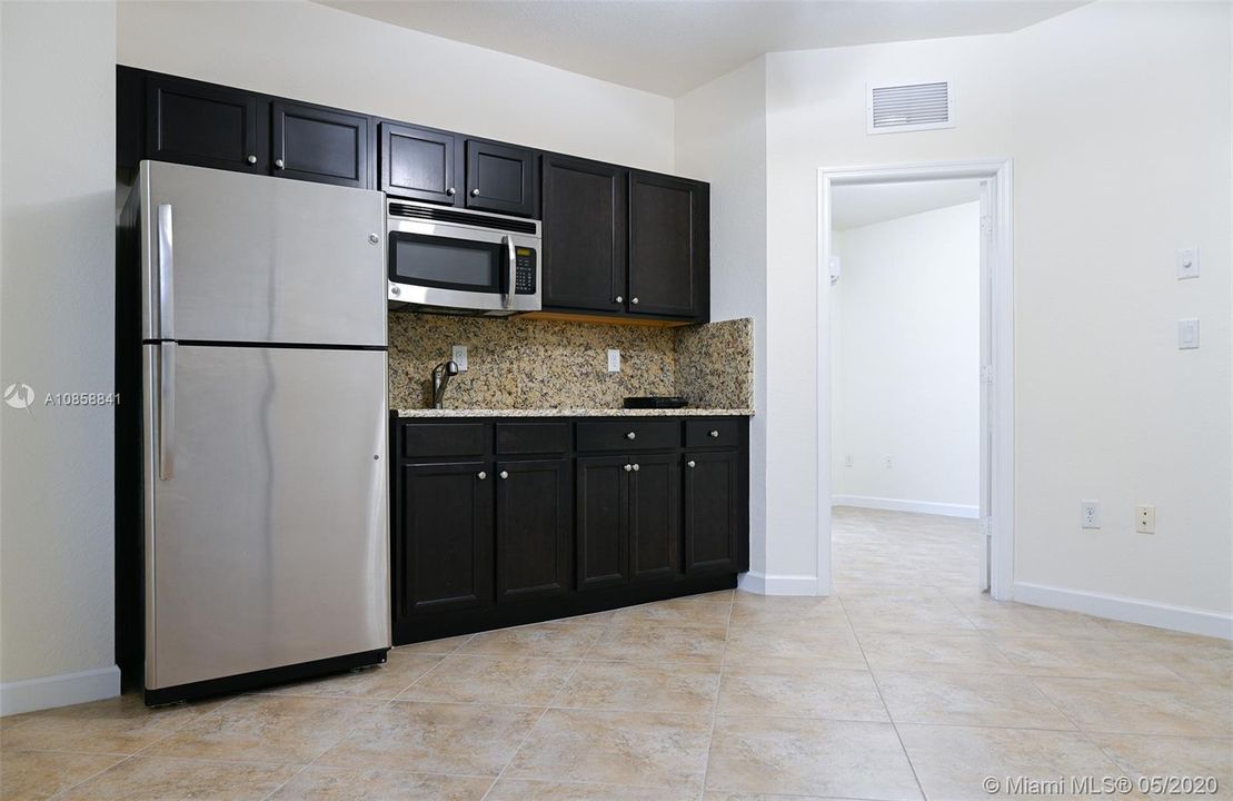 KITCHEN GRANITE COUNTERTOPS AND STAINLESS STEEL APPLIANCES