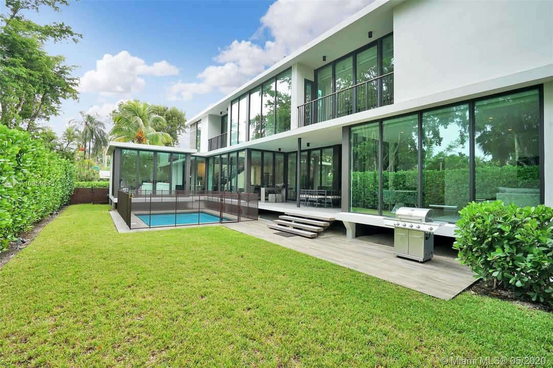 Green Space and Pool Area With Custom Entertainment Deck