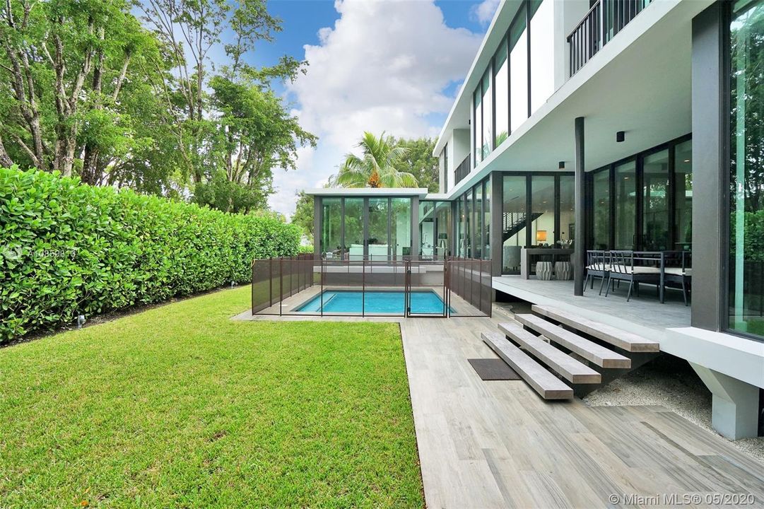 Green Space and Pool Area With Custom Entertainment Deck