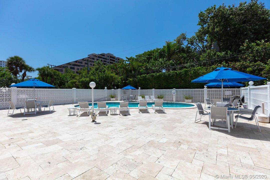 Beautifully maintained pool area with BBQ.