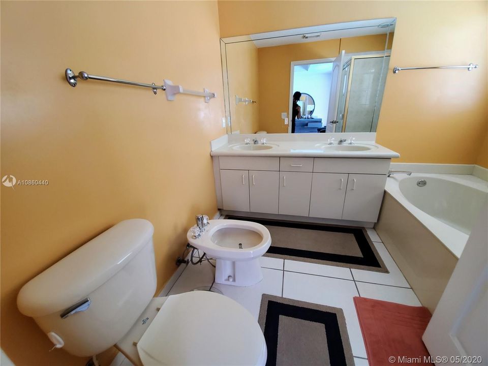 Master bathroom has bidet, dual sinks, separate tub and shower.