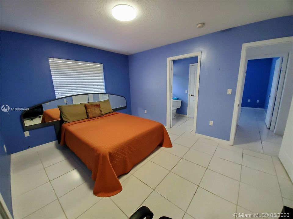Bedroom 2 with access to shared bathroom. Spacious rooms, bed is queen with ample room on all sides. 13'10" x 10'10"