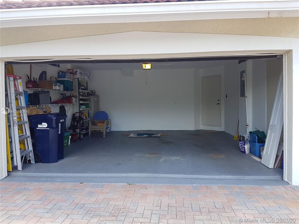 2 car automatic garage with storage shelves 19' x 19'8"