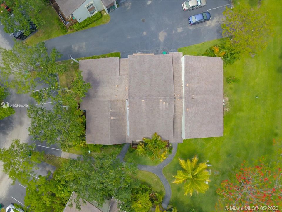 Bird eye's view from corner unit with back lawn yard