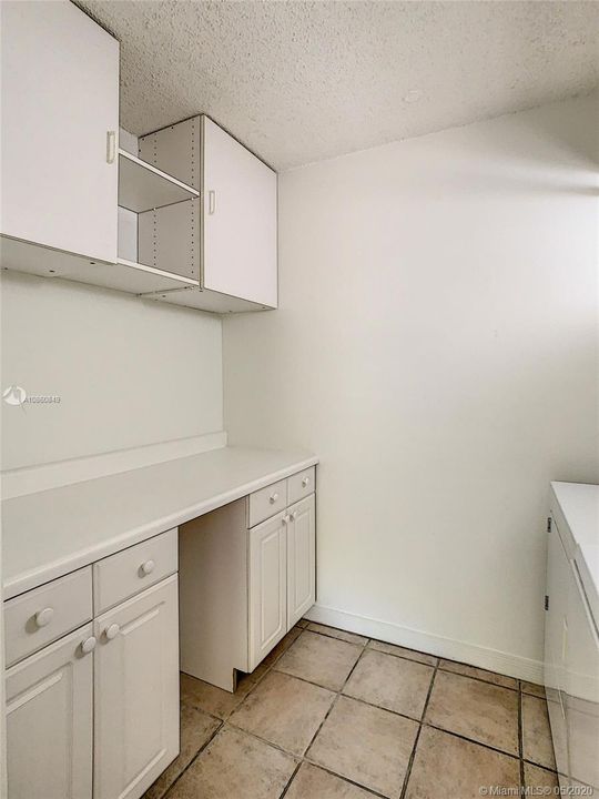 Laundry room with cabinets for storage