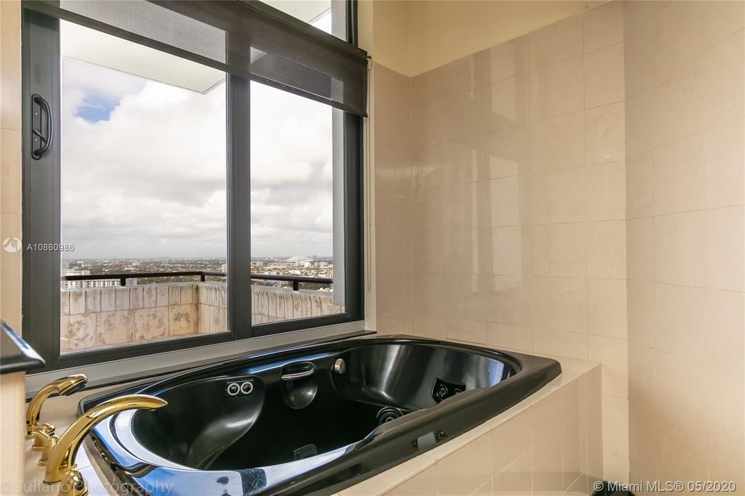 Master bathroom whirlpool and balcony view