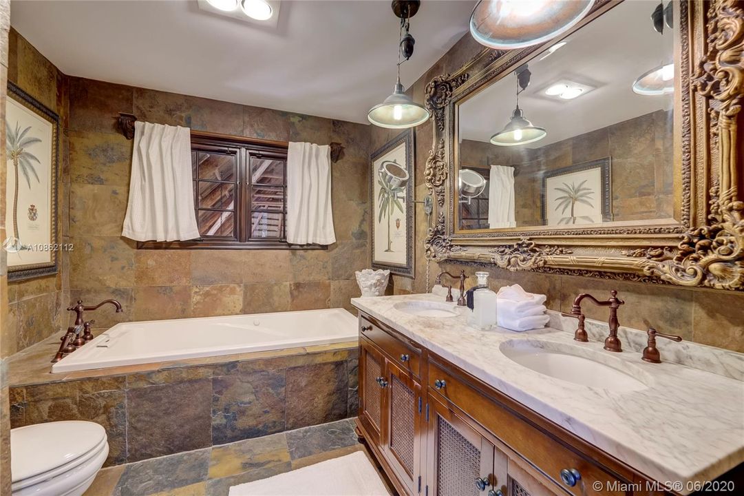 Upstairs full bath with soaking tub & dual marble vanity - slate flooring