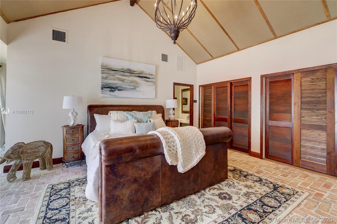 Cloth ceiling, tons of closet space, and natural light in this retreat
