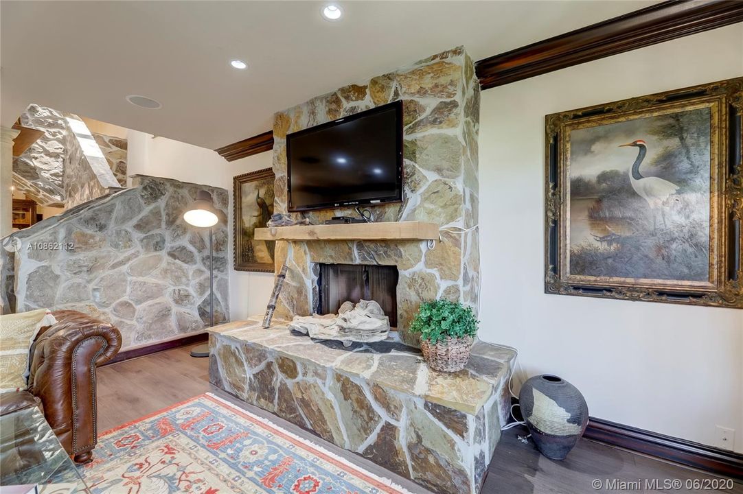 TV on stone fireplace surround