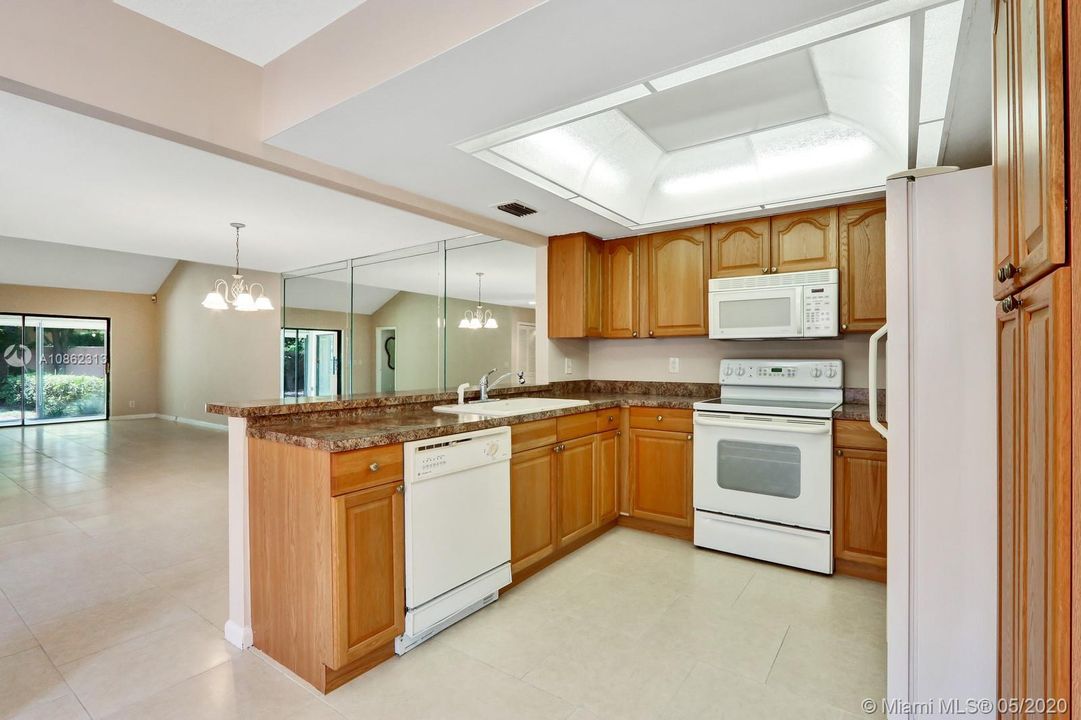 Kitchen Features Updated Cabinets & Counter Tops