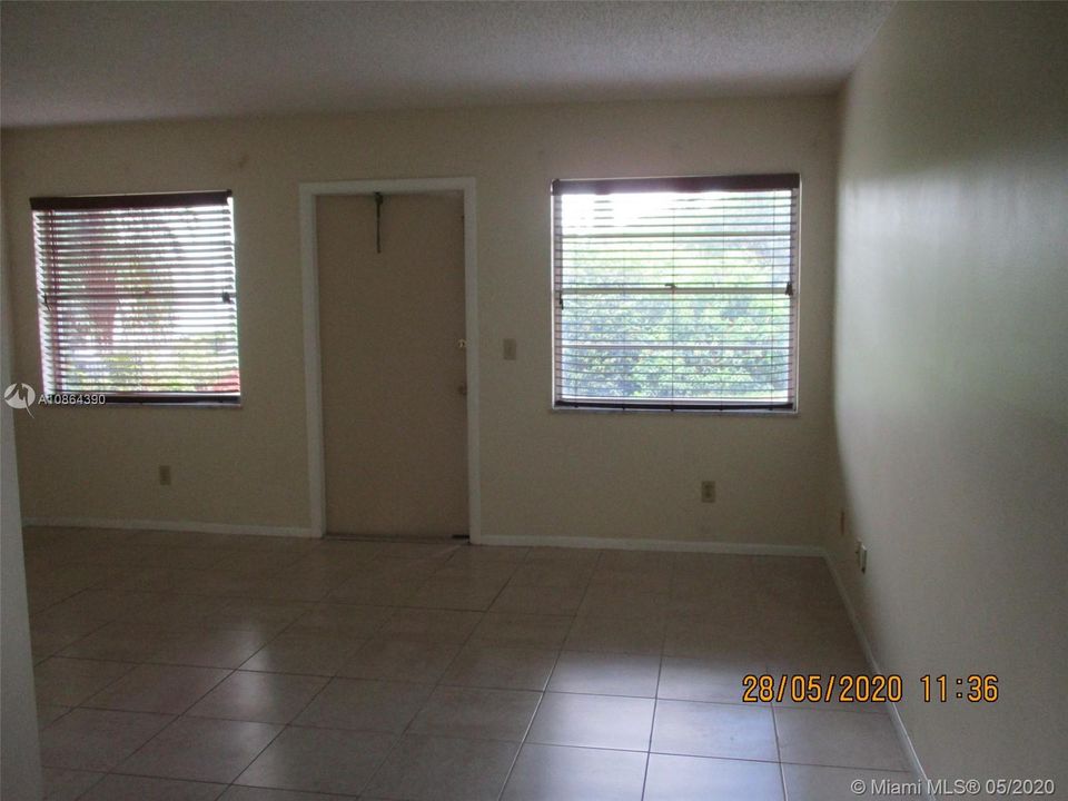 Living area with garden view through windows