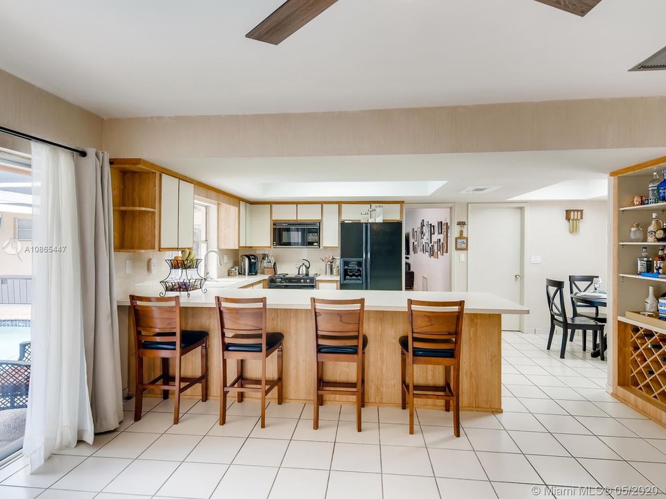 Kitchen with breakfast area seen on the right side