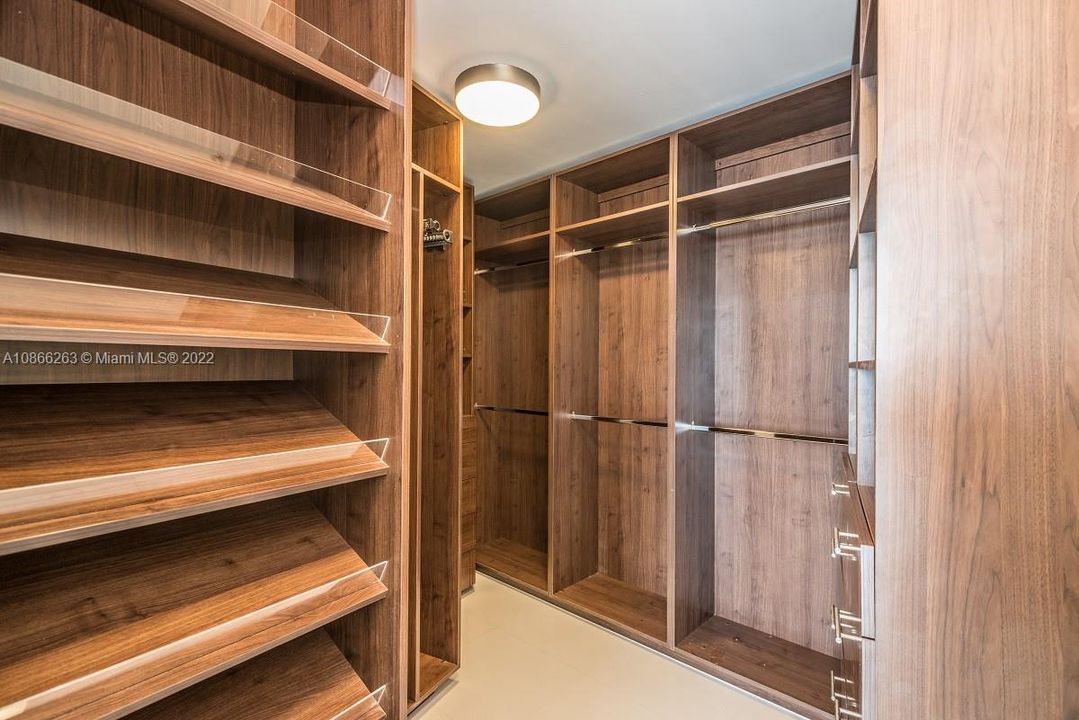 Master bedroom Walking closet: Lots of closet space!!! Spacious custom made walk-in closet with additional 3 doors closet on outside. This unit also includes a secured air-conditioned storage space on your parking level where your storables can be conveniently warehoused.