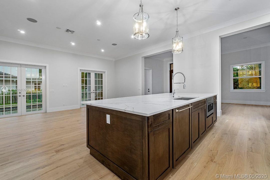 Custom wood stain island and quartz slab top