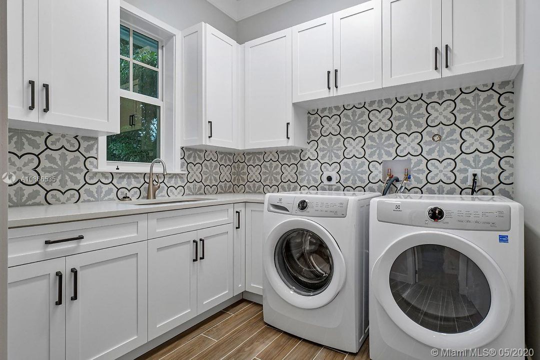 Main level laundry room w/ lots of storage